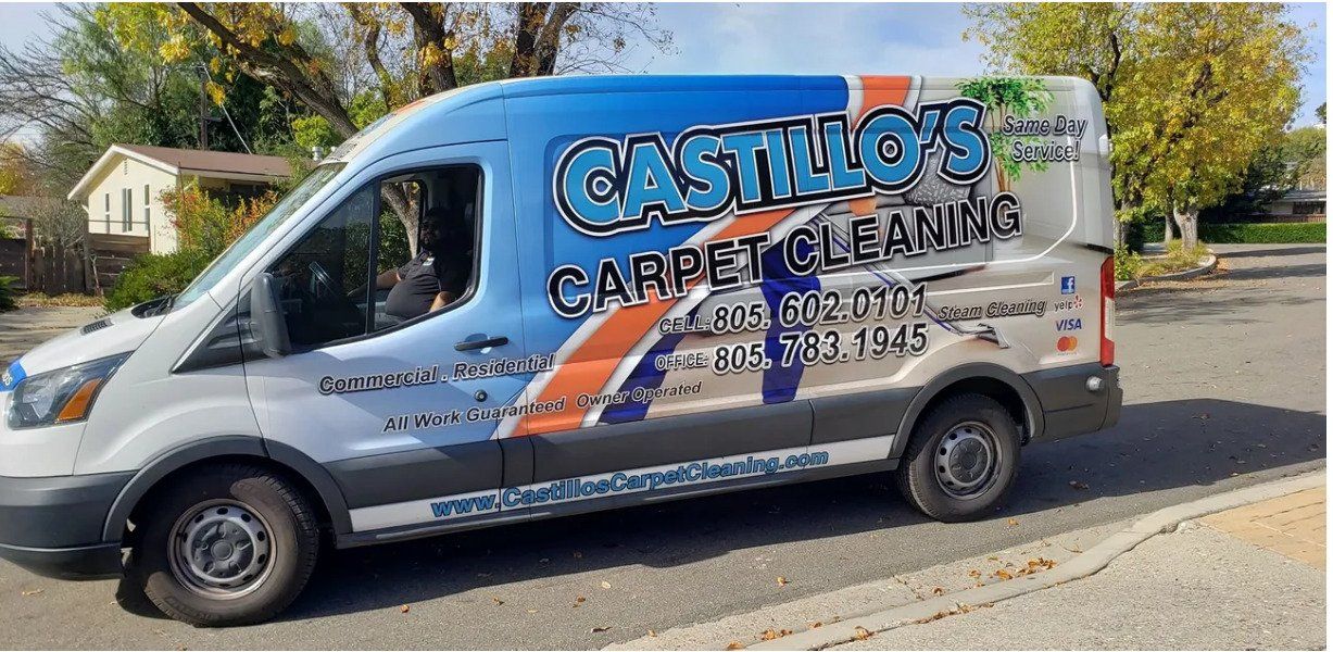 White Castillos Carpet Cleaning van parked on a street, with large blue and black business lettering.